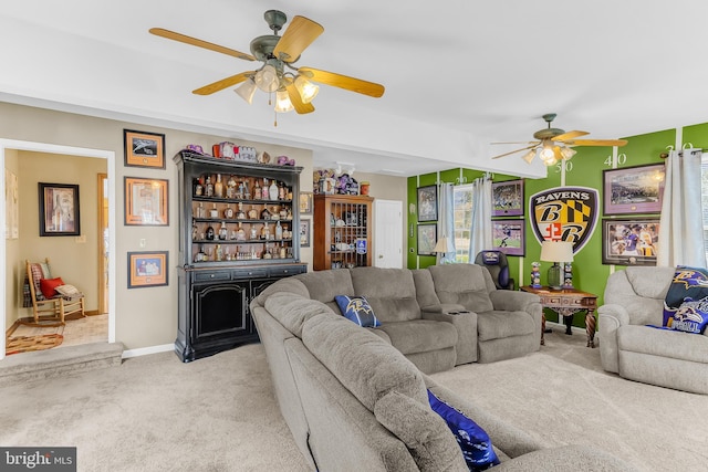 carpeted living room with ceiling fan