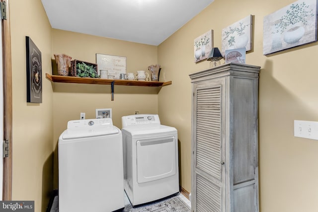 laundry area with independent washer and dryer