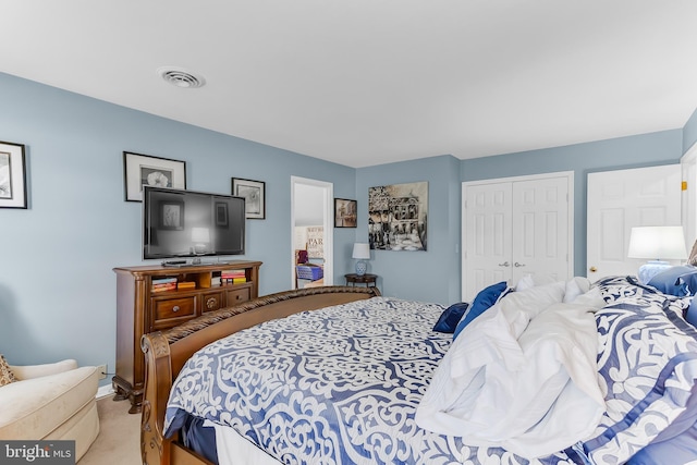 carpeted bedroom featuring a closet