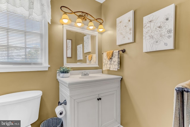 bathroom with vanity and toilet