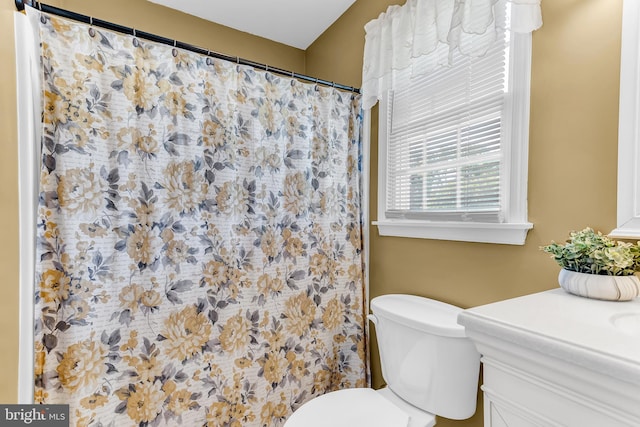 bathroom featuring vanity and toilet