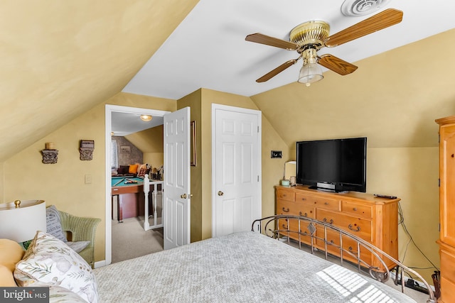 carpeted bedroom with lofted ceiling and ceiling fan