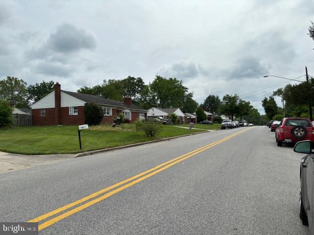 view of street featuring curbs and street lighting