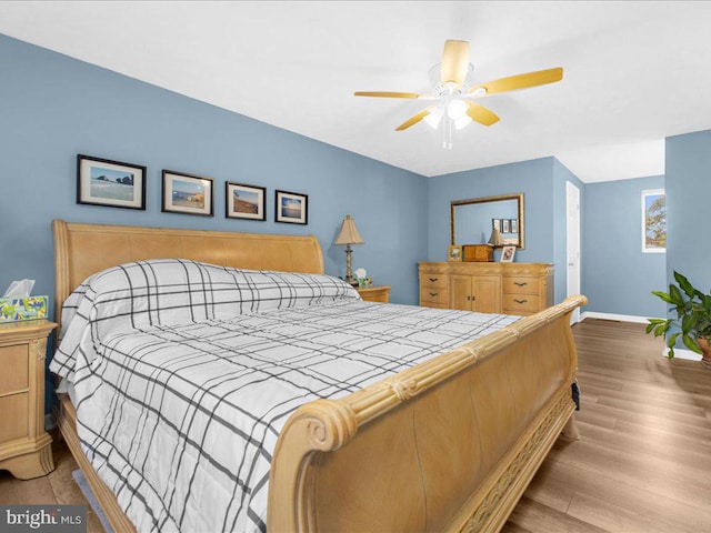 bedroom featuring ceiling fan and light hardwood / wood-style flooring