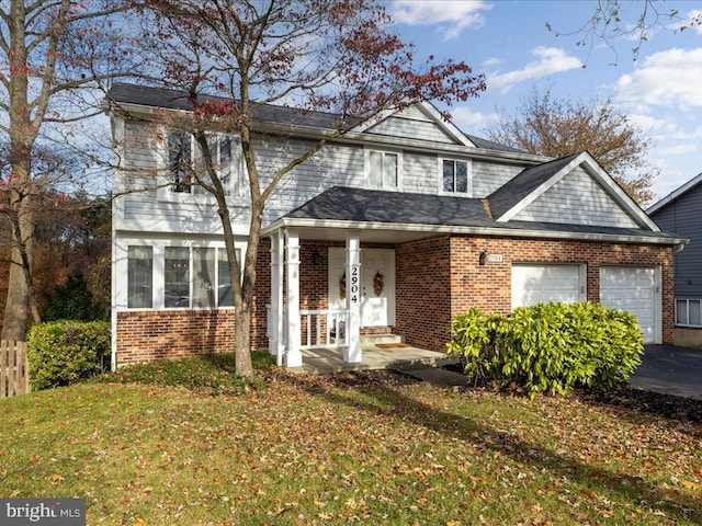 view of front facade with covered porch and a front yard