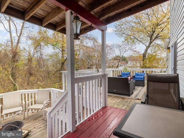 deck featuring outdoor lounge area