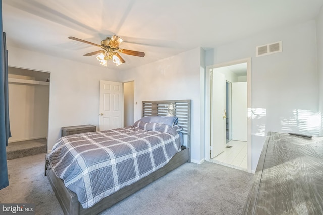 bedroom featuring ceiling fan and light carpet