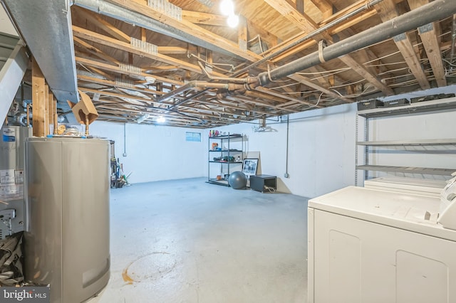 basement with independent washer and dryer and water heater