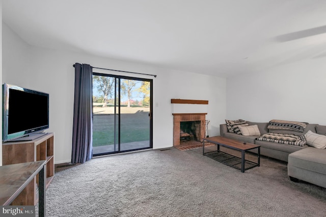 living room featuring carpet floors and a fireplace