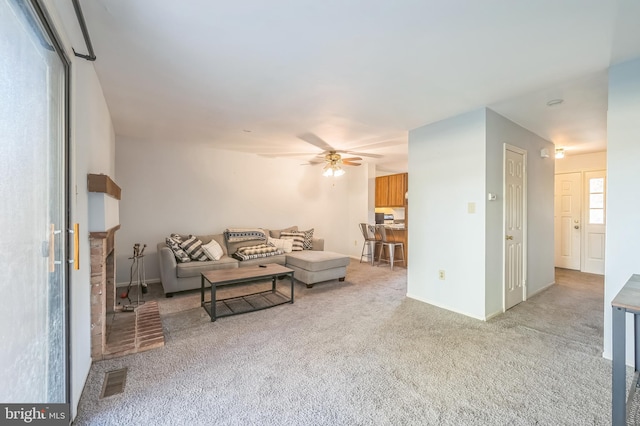 living room with ceiling fan and light colored carpet