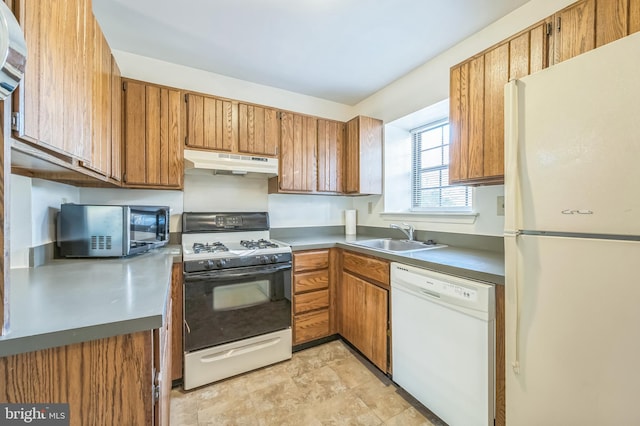 kitchen featuring sink and white appliances