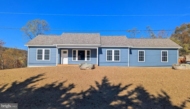 single story home featuring a front lawn