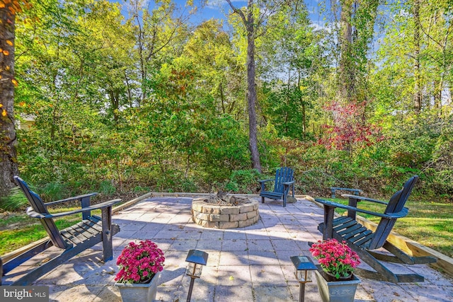 view of patio / terrace with an outdoor fire pit