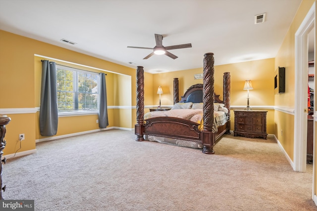 bedroom with ceiling fan and light colored carpet