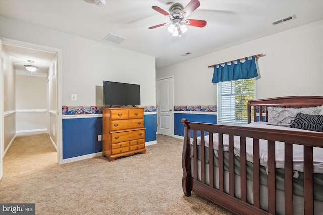 carpeted bedroom with ceiling fan