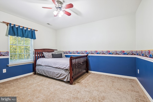 carpeted bedroom with ceiling fan