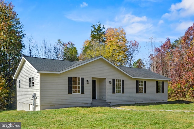 ranch-style house featuring a front yard