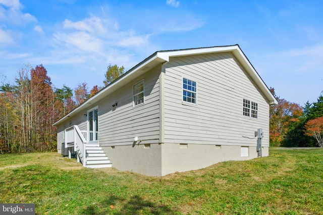 view of home's exterior featuring a yard