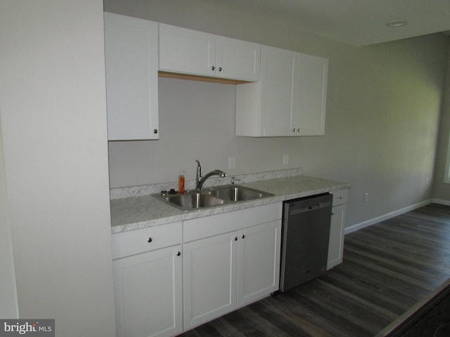 kitchen with sink, dishwasher, white cabinetry, and dark wood-type flooring