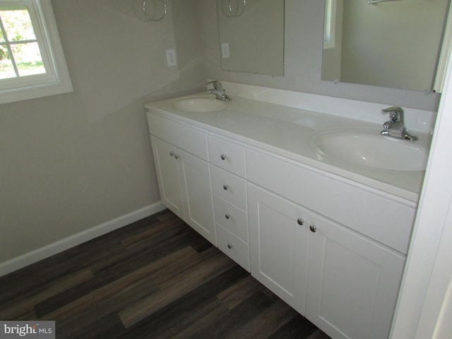 bathroom featuring vanity and wood-type flooring