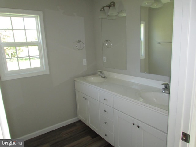 bathroom featuring vanity and hardwood / wood-style flooring