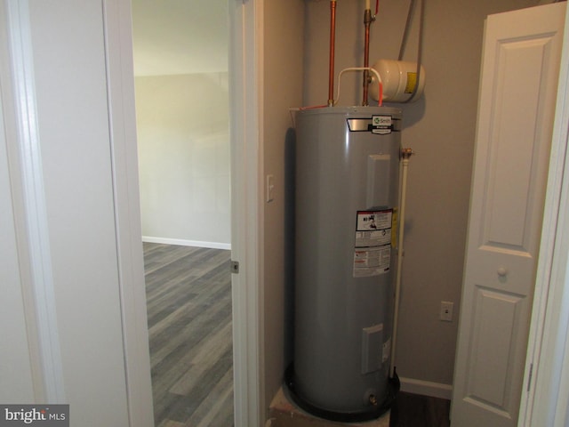 utility room featuring electric water heater