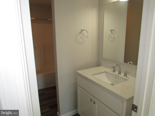 bathroom with vanity and hardwood / wood-style flooring