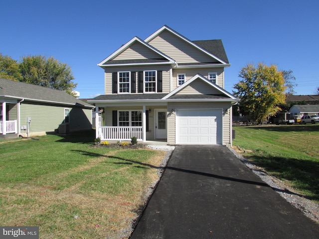 view of front of property featuring a garage, a front lawn, and a porch