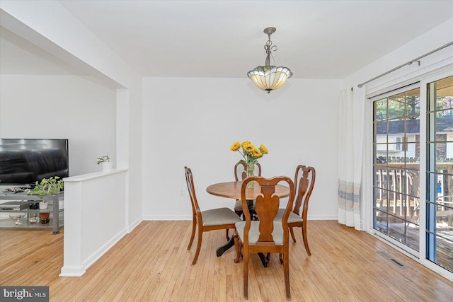 dining room with light wood-type flooring