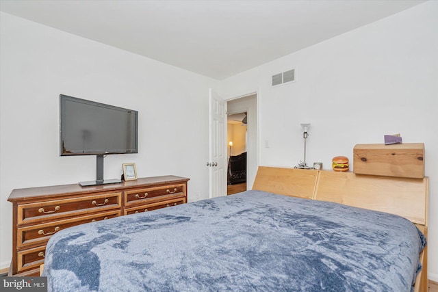 bedroom featuring wood-type flooring