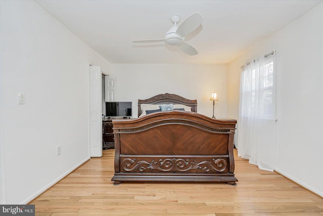 bedroom featuring light hardwood / wood-style flooring and ceiling fan