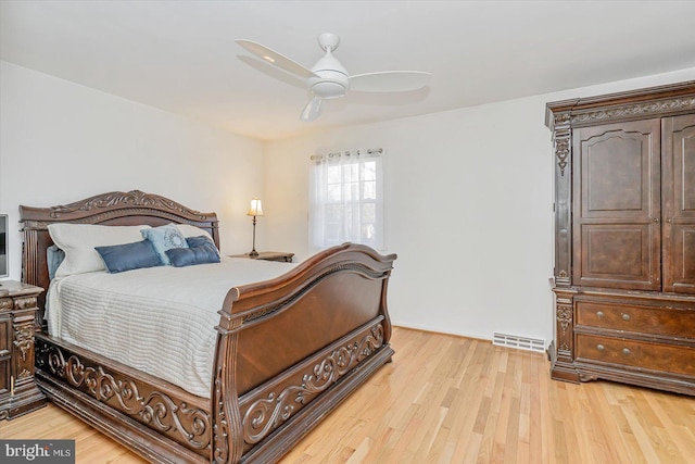 bedroom with light hardwood / wood-style flooring and ceiling fan