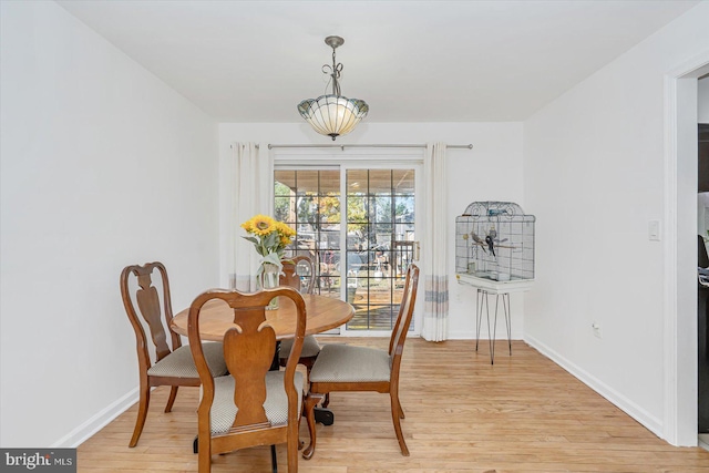 dining area with light wood-type flooring