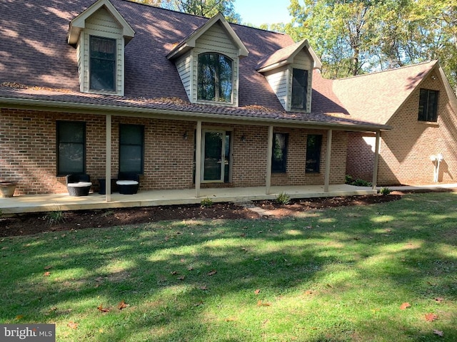 exterior space featuring a patio and a lawn