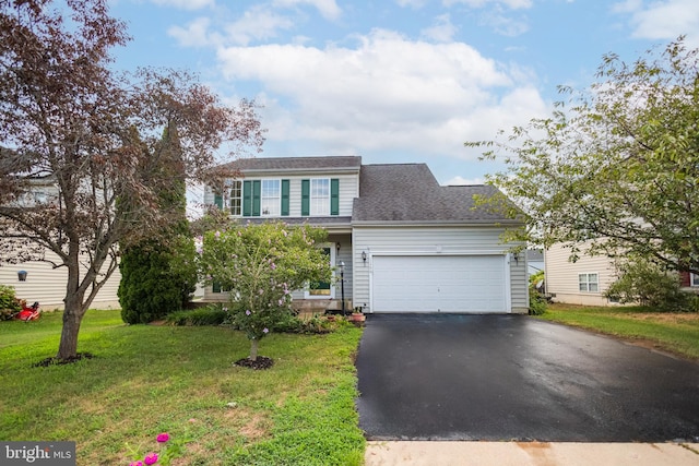 view of front facade featuring a front yard and a garage