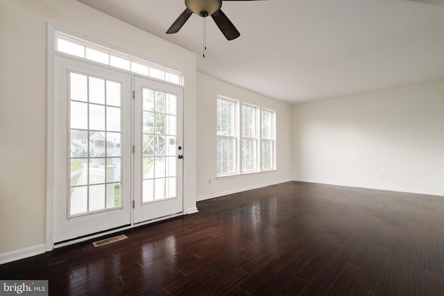 entryway with ceiling fan and dark hardwood / wood-style flooring