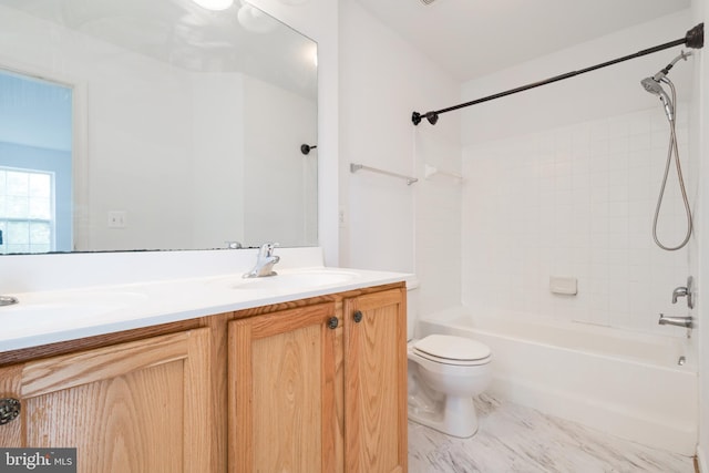 full bathroom with vanity, tiled shower / bath combo, and toilet