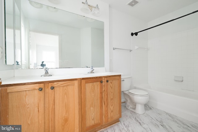 full bathroom featuring vanity, toilet, and tiled shower / bath combo