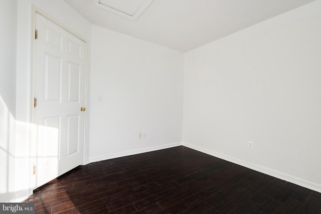 spare room featuring dark hardwood / wood-style floors