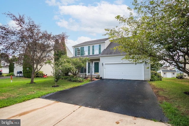 view of front facade with a front lawn and a garage