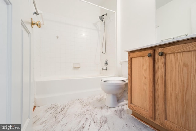 full bathroom featuring toilet, tiled shower / bath, and vanity