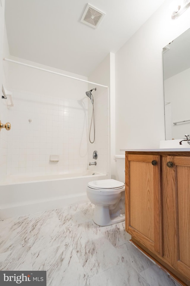 full bathroom with vanity, toilet, and tiled shower / bath