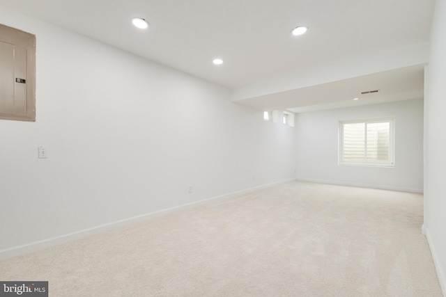 carpeted empty room featuring electric panel