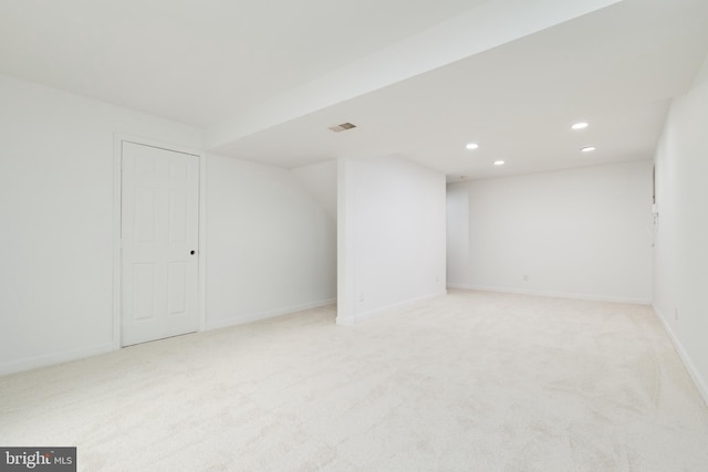 interior space featuring light colored carpet