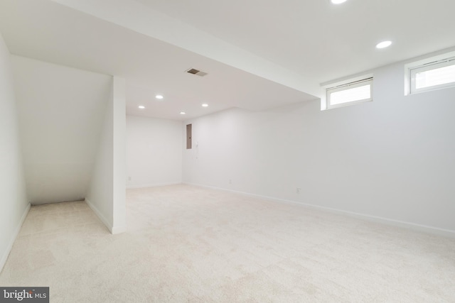 basement with light colored carpet