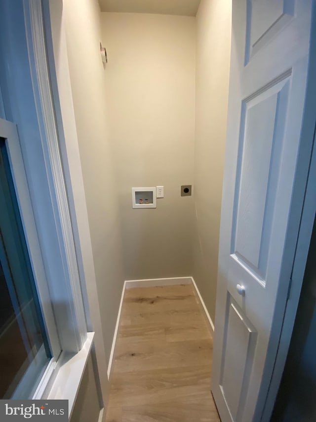 laundry room featuring hookup for an electric dryer, light wood-type flooring, and washer hookup