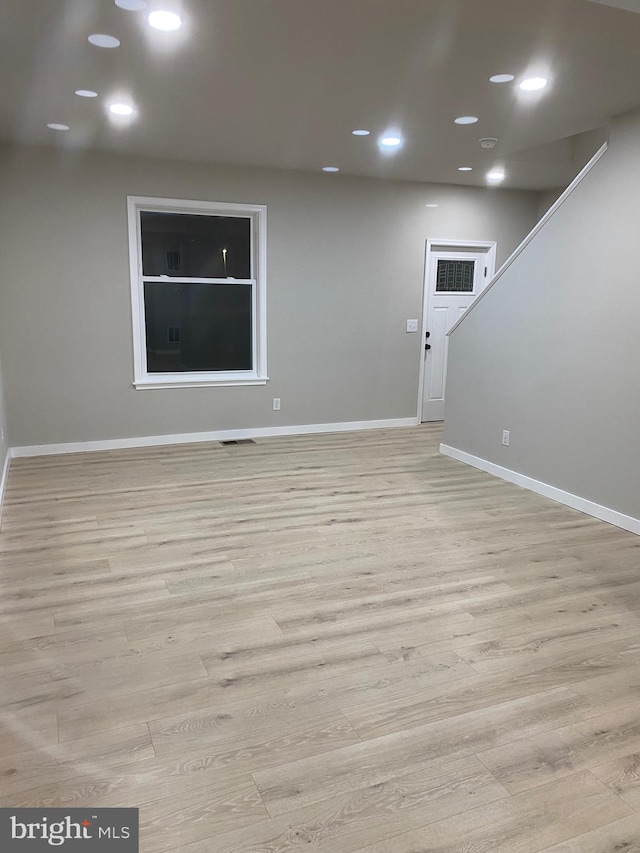 unfurnished room featuring light hardwood / wood-style flooring