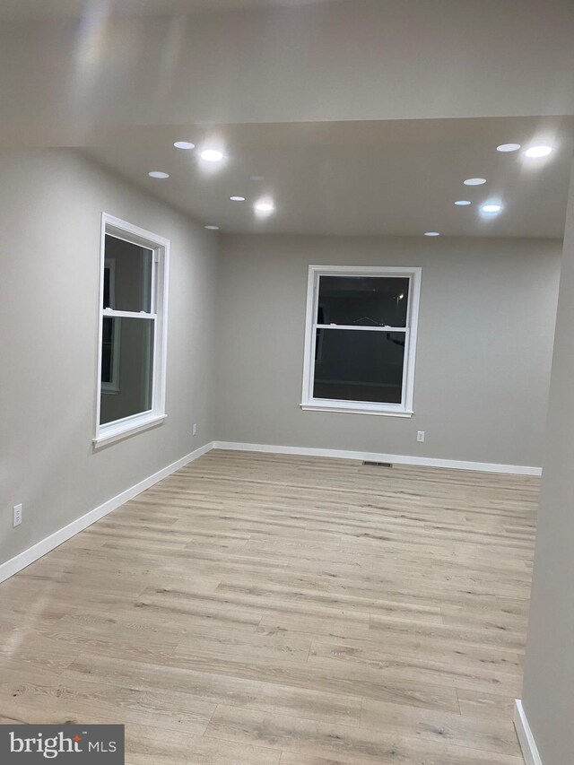 unfurnished room featuring light wood-type flooring