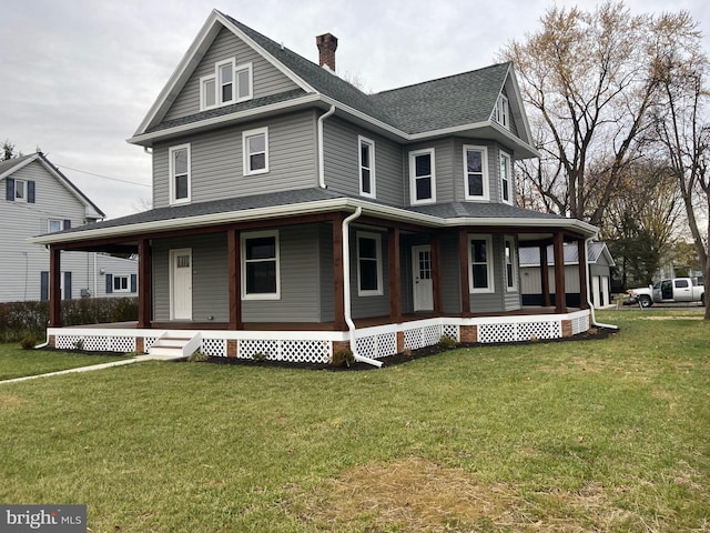 farmhouse featuring a porch, a front yard, a chimney, and roof with shingles