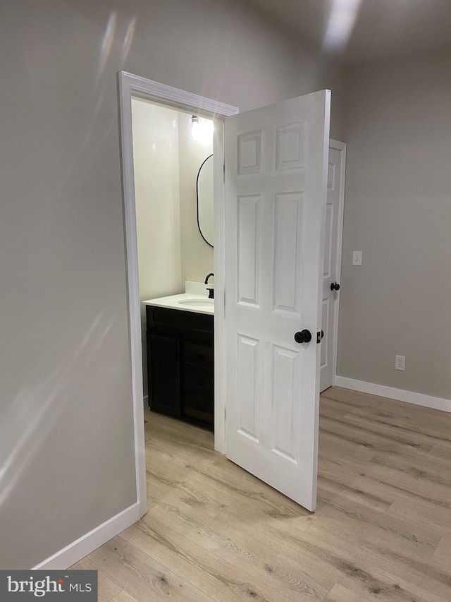 bathroom featuring vanity and wood-type flooring